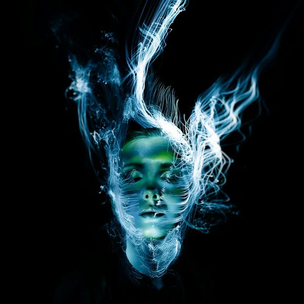 A silhouette of a man in a balancing pose against a light blue background.